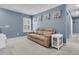 Cozy living room with blue walls, plush tan sofa, and elegant side tables at 707 Jancus St, Charleston, SC 29414
