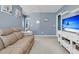 Spacious living room features a comfortable couch and a TV stand with storage at 707 Jancus St, Charleston, SC 29414