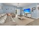 Bright and airy living room with a plush sectional sofa, modern decor, and a sliding glass door at 707 Jancus St, Charleston, SC 29414