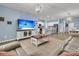 Inviting open-concept living room and kitchen featuring a large TV and comfortable leather seating at 707 Jancus St, Charleston, SC 29414