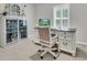 Charming office space with white desk, cabinets, and a window with plantation shutters at 707 Jancus St, Charleston, SC 29414