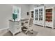 Bright office features a white desk, a cabinet, a bookcase, and a shuttered window at 707 Jancus St, Charleston, SC 29414