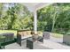 Inviting covered patio with comfortable seating and view of the backyard at 707 Jancus St, Charleston, SC 29414