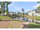 Scenic backyard with a pond and a lush grassy area at 707 Jancus St, Charleston, SC 29414