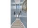 Blue walled staircase is brightly lit and features decorative artwork along the walls at 707 Jancus St, Charleston, SC 29414