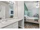 Bathroom with neutral colors, a long countertop, and a view into the bedroom at 7999 Vermont Rd, North Charleston, SC 29418
