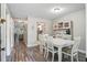 Bright dining room with hardwood floors, a large table, and a charming hutch at 7999 Vermont Rd, North Charleston, SC 29418