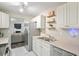 Efficient kitchen boasts stainless appliances, sleek counters, and open layout to the living area at 7999 Vermont Rd, North Charleston, SC 29418