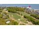 Aerial view of community overlooking the golf course with manicured greens and coastal views at 9002 Palmetto Dr # 119, Isle of Palms, SC 29451
