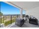 Relaxing balcony featuring comfortable wicker furniture and beautiful ocean views at 9002 Palmetto Dr # 119, Isle of Palms, SC 29451