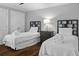 Clean bedroom featuring two twin beds, each with fresh linens and bath towels at 9002 Palmetto Dr # 119, Isle of Palms, SC 29451
