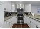 Modern kitchen with stainless steel appliances, granite countertops, and ample cabinet space at 9002 Palmetto Dr # 119, Isle of Palms, SC 29451