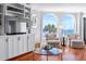 Living room features built-in shelves, comfortable seating, and stunning ocean views at 9002 Palmetto Dr # 119, Isle of Palms, SC 29451