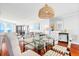 Spacious living room features hardwood floors, modern decor, and beautiful ocean views at 9002 Palmetto Dr # 119, Isle of Palms, SC 29451