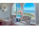Relaxing ocean view from living area featuring comfortable chairs at 9002 Palmetto Dr # 119, Isle of Palms, SC 29451