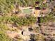 Overhead view of a rural property with a pond and surrounding trees at 945 Tiger Loop, Saint Stephen, SC 29479