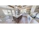 Stylish kitchen with an island, wood accents, and a view to a breakfast nook at 945 Tiger Loop, Saint Stephen, SC 29479