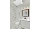 Bathroom with white tiled shower, vanity, and dark wood framed mirror at 9630 Crosscut Dr, Ladson, SC 29456