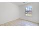 This bedroom boasts neutral floors and a window overlooking the home's exterior at 9630 Crosscut Dr, Ladson, SC 29456