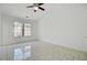 A bedroom with a ceiling fan and a large window providing natural light at 9630 Crosscut Dr, Ladson, SC 29456
