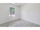 Bedroom with bright window, white walls, and neutral tiled floors at 9630 Crosscut Dr, Ladson, SC 29456
