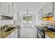Bright kitchen area with a breakfast nook, granite countertops, and tile floors at 9630 Crosscut Dr, Ladson, SC 29456