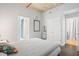 A modern bedroom featuring a bed, and a view into the bathroom and laundry closet at 1 Cool Blow St # 337, Charleston, SC 29403