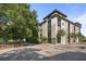 Exterior shot of a large apartment building with a tree-lined street at 1 Cool Blow St # 337, Charleston, SC 29403