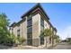 Modern building exterior with large windows, palm trees, and visible street access at 1 Cool Blow St # 337, Charleston, SC 29403