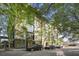 Modern building featuring lush trees surrounding the entry with convenient street parking at 1 Cool Blow St # 337, Charleston, SC 29403