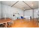 Open-concept living area with a dining table, seating area, and neutral wall decor at 1 Cool Blow St # 337, Charleston, SC 29403