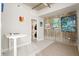 A modern living room with an industrial design, featuring art, an open laundry closet, and concrete accents at 1 Cool Blow St # 337, Charleston, SC 29403