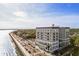 Stunning aerial view of a beautiful waterfront property with palm trees and a pool in a desirable coastal location at 1 King St # 501, Charleston, SC 29401