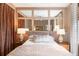 Bedroom with symmetrical design, decorative pillows, and woven blinds at 1 King St # 501, Charleston, SC 29401