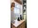 Charming breakfast nook with waterfront view, custom shelves, and coffee bar at 1 King St # 501, Charleston, SC 29401