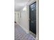 Apartment 501 is on a hallway with patterned carpets and sconce lighting at 1 King St # 501, Charleston, SC 29401