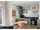 Eat-in kitchen with marble table, modern appliances, and plenty of natural light from a large window at 1 King St # 501, Charleston, SC 29401