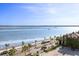 Scenic waterfront view with palm trees and boating activity at 1 King St # 501, Charleston, SC 29401