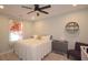 Comfortable bedroom featuring a queen-size bed, ceiling fan, and a soft color palette at 1044 Towhee Ln, McClellanville, SC 29458