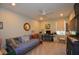 Functional bedroom featuring a daybed, ceiling fan, and a large desk, creating a multi-purpose space at 1044 Towhee Ln, McClellanville, SC 29458