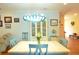 Inviting dining room boasts a unique light fixture and elegant decor creating a warm ambiance at 1044 Towhee Ln, McClellanville, SC 29458