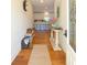 Inviting foyer with hardwood floors and stylish decor, leading to the kitchen at 1044 Towhee Ln, McClellanville, SC 29458