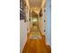 Hallway with wooden floor, light walls, and classic trim at 1044 Towhee Ln, McClellanville, SC 29458