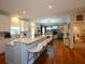 Spacious kitchen featuring a large island with bar seating and open floor plan at 1044 Towhee Ln, McClellanville, SC 29458