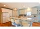 Bright kitchen with white cabinetry, stainless steel appliances, and a large center island at 1044 Towhee Ln, McClellanville, SC 29458