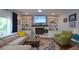 Comfortable living room with built-in shelves, fireplace, and stylish decor creating a welcoming space at 1044 Towhee Ln, McClellanville, SC 29458