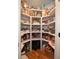 Walk-in pantry with custom shelving providing ample storage for food and household items at 1044 Towhee Ln, McClellanville, SC 29458