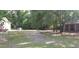 Large backyard with mature trees and room to enjoy activities with Gathering at 107 Kelly St, Walterboro, SC 29488