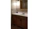 Bathroom vanity with white countertop and wood cabinets at 107 Kelly St, Walterboro, SC 29488