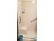 Accessible walk-in shower featuring a convenient seat and safety grab bars at 107 Kelly St, Walterboro, SC 29488